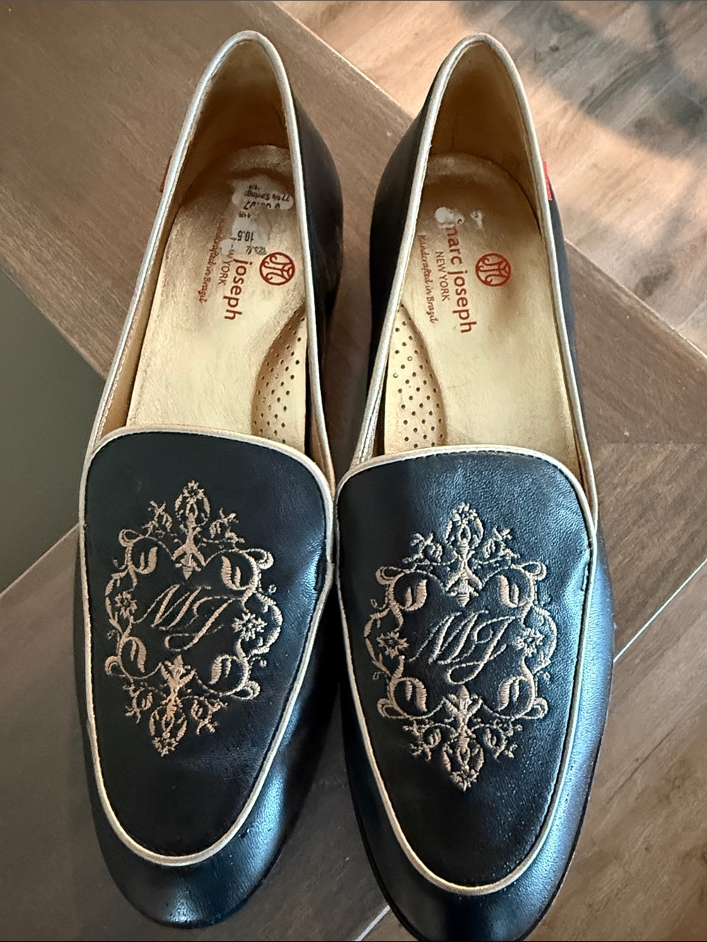 Marc Joseph Black Leather Loafers with Gold Embroidered Crest